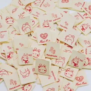 100PCS Handmade Double-Fold Fabric Labels, Cute Red Line Art with Love & "Handmade" Text for Perfect for Handicrafts, Sewing, Playful Design, Durable Labels,Suitable for Clothing, Bags, Shoes