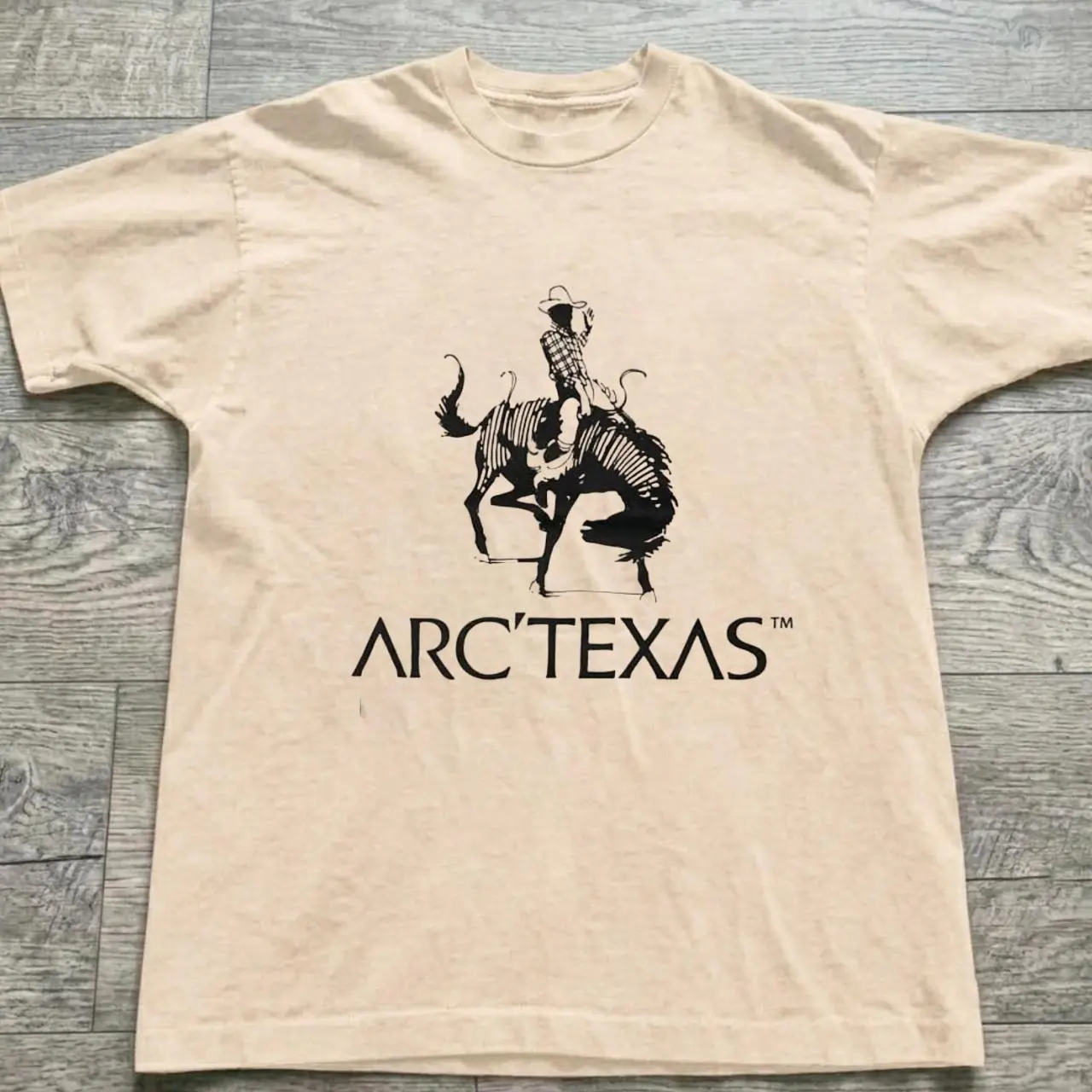 Gildan Men's T-shirt, Arc'teryx cream t-shirt with black graphic of a cowboy, gildan reprint shirt, Vintage Western Cowboy Graphic Tee, Retro Ranch Shirt, Unisex Country Aesthetic T-Shirt, 90s Western Streetwear, Cowboy Gift