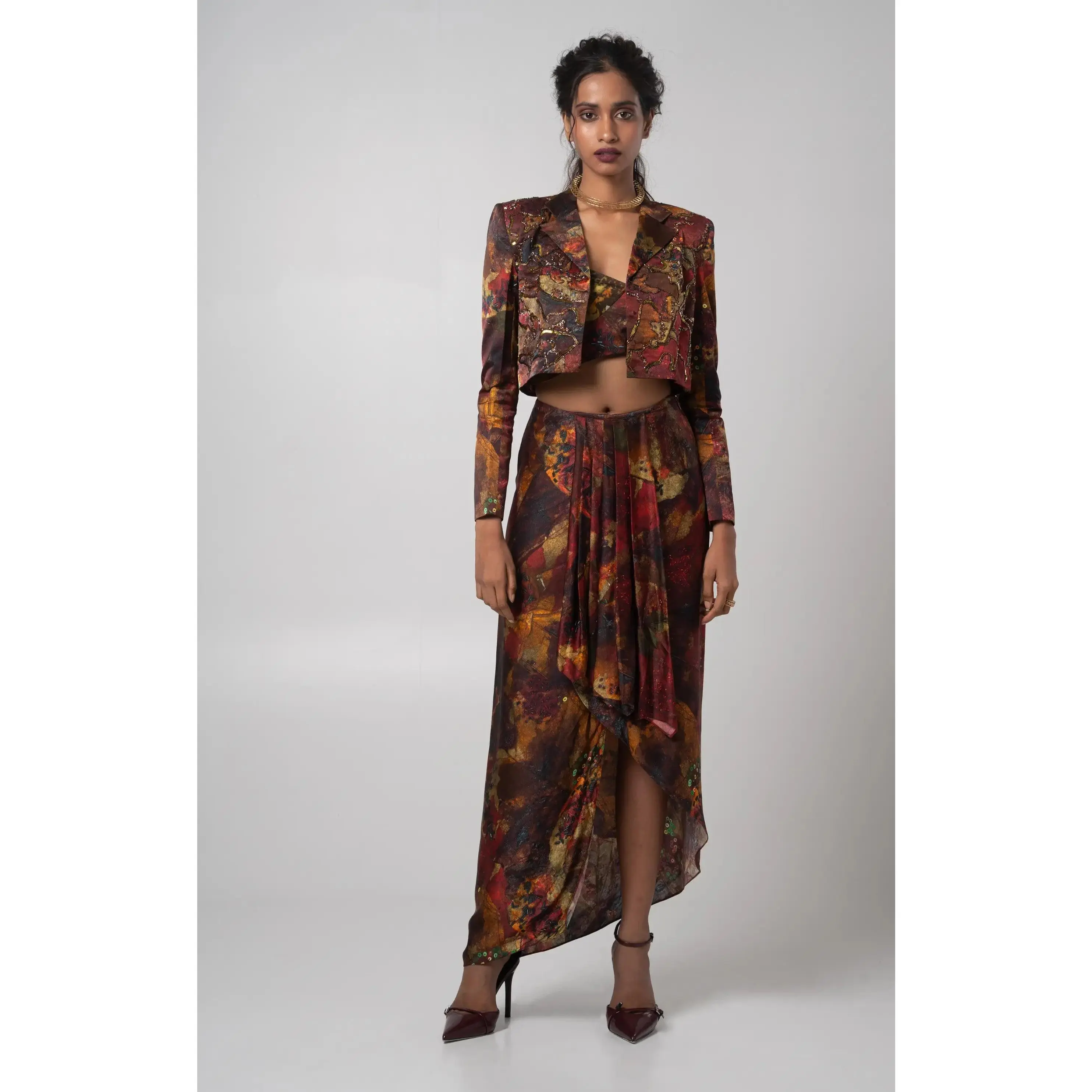 Multicolored cropped jacket with bustier and a draped skirt