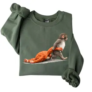 Monkey Punnch Graphic Sweatshirt – Baby Monkey Holding Plush Toy, Cute Animal Lover Gift, Cozy Unisex Hoodie Pullover