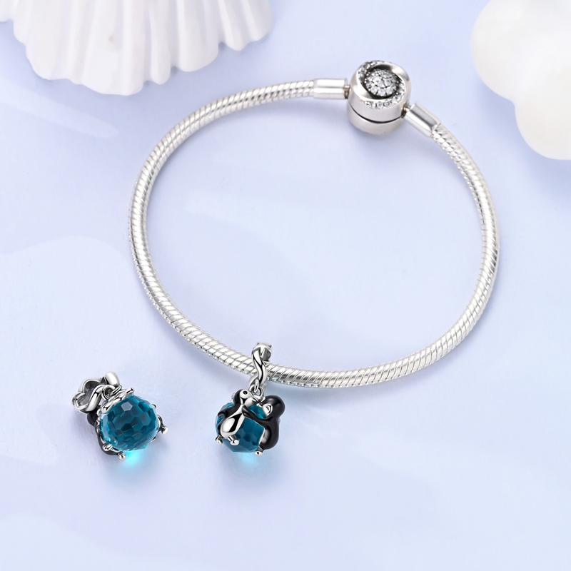 MULA S925 Sterling Silver Dancing Penguin Charm with Blue Glass Crystals and Enamel Details - Coordinates with Pandora Bracelets and Necklaces, Makes a Cute Animal Jewelry Gift for Girls, Teens, Women