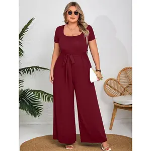 Plus-size solid-color wide-leg jumpsuit with an elegant square neckline and lace-up design, suitable for everyday outdoor wear; a women’s jumpsuit appropriate for all seasons. GARMENTARY