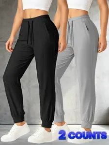 2-pack women’s quick-dry athletic pants, lightweight and breathable, featuring a drawstring elastic waistband and side pockets with anti-theft zippers; versatile for all seasons and suitable for everyday wear and various outdoor sports activities.