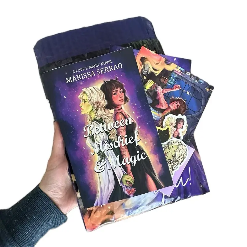 Bundle Bag: Between Mischief & Magic Signed Paperback, Art, and Stickers