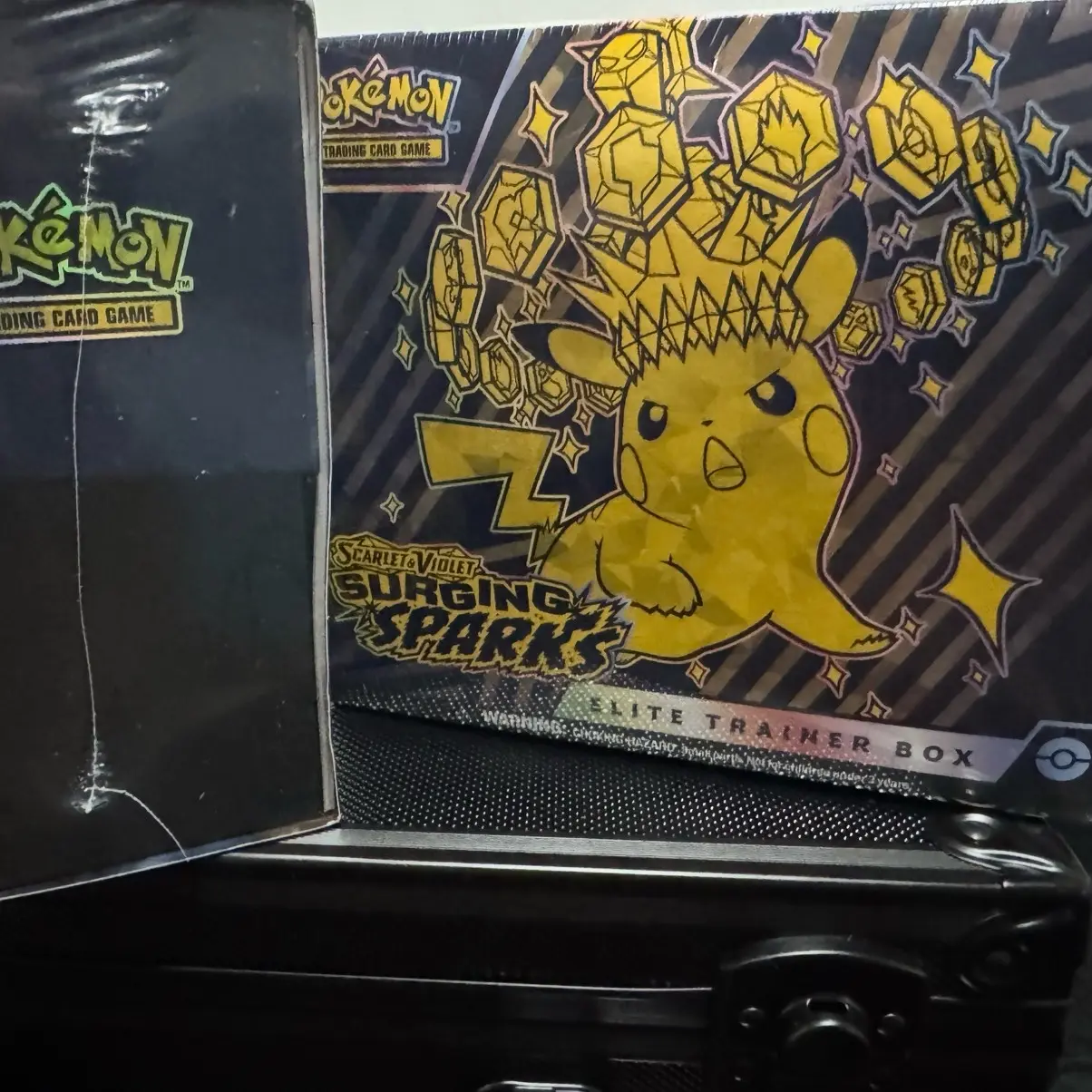 Pokmon - Trading Card Game: Scarlet & Violet - Surging Sparks Elite  Trainer Box - TikTok Shop