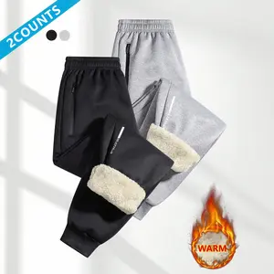 Men's casual fleece pants two-piece set, featuring drawstring design with zippered pockets, made from thick sheepskin lining, providing a warm and comfortable wearing experience.