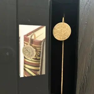 Quran Bookmark Engraved with Islamic Calligraphy, Stylishly crafted metal bookmark, perfect gift for every occasion.