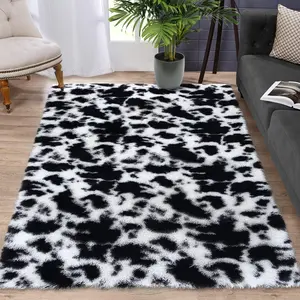 GARVEE Explore the GARVEE Shag Rug Collection: Soft, Plush, Modern Rugs with Non-Skid Backing in Various Sizes, Perfect for Living Rooms, Bedrooms, Nurseries, Featuring Unique Cow Print and Tie-Dyed Designs in Black and White.