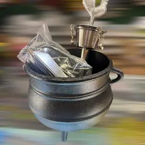 Set of Guerreros Santeria featuring a Black Pot with Silver Accessories and Wrapped Item Cookware