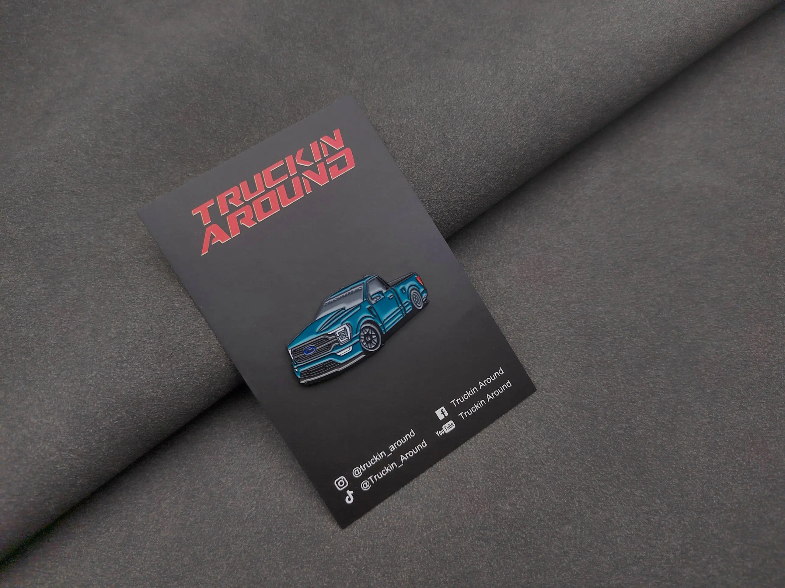 Coyote TAG-29 5.0 Hat Pin - Classic Blue Design with "TRUCKIN AROUNDS" Text and Logo