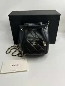 Pre-owned CHANEL 25B Microchip Edition Black Caviar Leather Drawstring Mini Bucket Bag – 98% New Includes: Box, Dust Bag, Instruction Booklet
