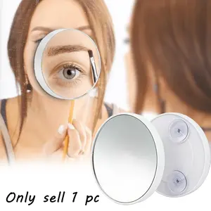 White suction cup magnifying makeup mirror, handheld design, suction cup for easy attachment, suitable for bathrooms and vanities, Bathroom Vanity Mirror, no batteries required, enhances the makeup experience, a beauty accessory.