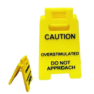 Caution Overstimulated Desk Sign – Yellow Sign w/ Black Text | Humorous Gag Gift for Coworkers/Boss/Employees | Mini Novelty Desk Decor