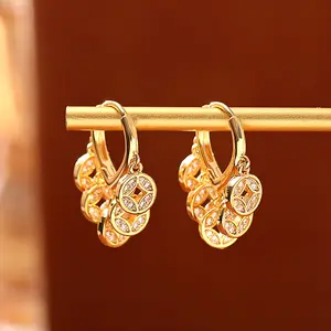 Cool and edgy openwork geometric coin tassel earrings, minimalist retro and unique jewelry, a spring declaration.