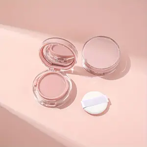 A small pink mini hollow cosmetic box with a refillable container for foundation and BB cream samples. It has a built in mirror and a portable flip-top design with a sponge for easy storage of the travel essential makeup bag.