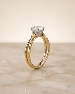 The Blondie Twisted Hidden Halo Solitaire Engagement Ring Setting for Round Diamonds in 18K Yellow Gold