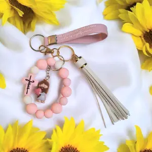 Pink Jesus Bracelet Keychain - Limited Edition Accessory with Detailed Charm & Tassel - Stylish & Meaningful Fashion Accessory