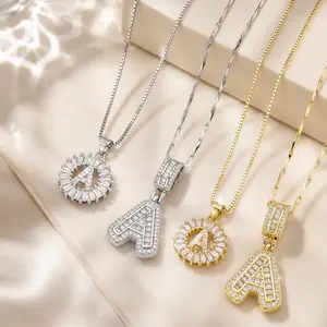 Light Luxury Sparkling Step-Cut Diamond Initial Necklace available in two designs: circular ring and thick version, a popular accessory in gold and silver two-tone finishes name