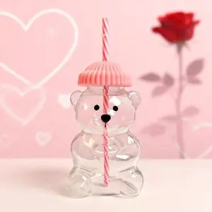Adorable Teddy Bear Glass Straw Cup Seasonal Drinkware Coffee & Beverage Cup with Green & Pink Lids High Borosilicate Glass Tumbler for 2026 Holiday Collection Mug Shaped Tumblers Bottles ice  coffee  glass