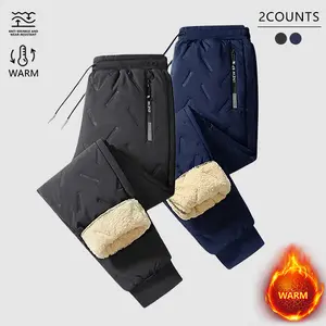2 Pack Men's Thermal Insulated Winter Pants - Heavyweight warm fleece lined pants with elastic ankle cuffs, machine washable polyester fabric suitable for skiing, snowboarding, and outdoor activities, zippered pockets and drawstring waistband, tapered des