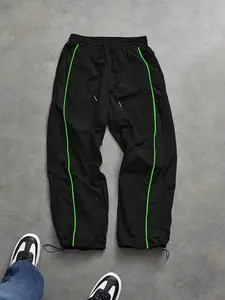 Men’s black athletic pants with an elastic waistband, made from moisture-wicking fabric that is breathable and sweat-resistant, featuring practical side pockets—designed for year-round wear, fitness activities, urban streetwear, and casual outings.