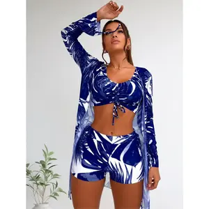 Summer blue and white printed three-piece swimsuit, trendy tropical swimwear featuring a front-tie short top, high-waisted shorts, and matching long-sleeved cover-up, perfect for beach vacations and pool parties
