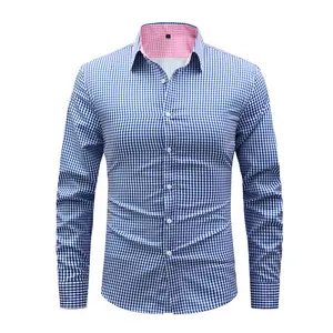 A men’s long-sleeve shirt featuring a plaid color-block design, styled for business casual. Its classic pointed collar is sharp and well-structured, while the pink-and-white plaid interior adds refined details. White front buttons add a clean, streamlined