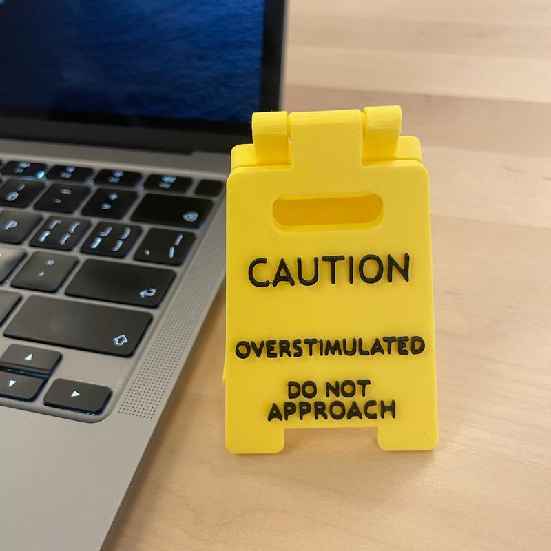 Caution Overstimulated Desk Sign - Yellow Sign with Black Text,  Humor Gag Gift for Coworkers, Boss & Employees, Mini Novelty Funny Desk Decor