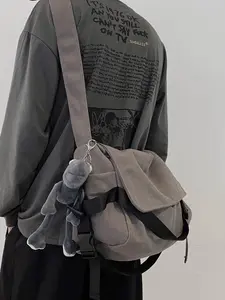 Stylish Plain Canvas Crossbody Bag for Men with Cartoon Charm Large Capacity Shoulder Bag Perfect for Work and School Commute