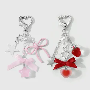 Set of 2 sweet girl DIY keychains and bag charms featuring stars, hearts, strawberries, and bows—simple, versatile, attractive, multicolored. Suitable for sisters and best friends’ everyday wear; great as a holiday gift.