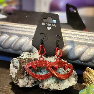 Handmade Dazzling Vampire Teeth Resin Earrings with Red Glitter Design and Heart Charm