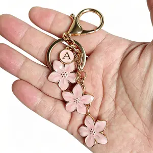 There are 26 letters to choose from,Women's letter A keychain cherry blossom keychain crossbody bag simple backpack student girl backpack plum blossom flower mobile phone handbag decoration pendant