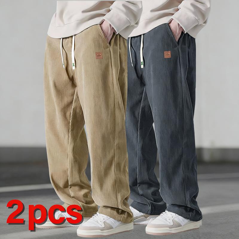 Two men's autumn casual pants featuring a simple and versatile style with drawstring design, adding a casual feel. The pants have delicate small details, such as stitching accents, making them comfortable and stylish. The loose fit provides comfort and fr
