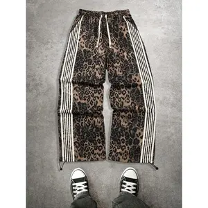 Autumn and winter men's leopard print work pants | high street striped side pants | loose drawstring waist pants | casual and fashionable street running pants | elastic cuff sports pants | fashionable animal print white striped pocket pants