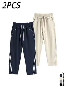 Multi-pack men’s casual long pants for spring and autumn, featuring a deconstructed color-block striped patchwork design, drawstring elastic waistband, loose fit—versatile for everyday wear, leisure, sports, and fitness.