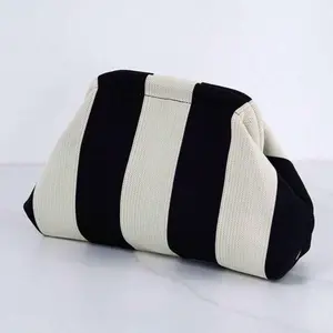Black and white woven clutch