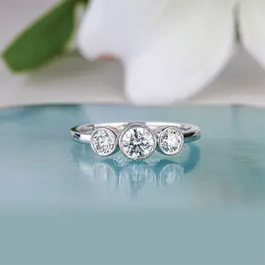 Bezel Set Round Cut Trilogy Engagement Ring