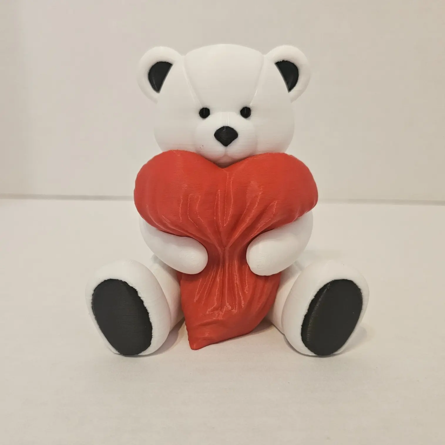 Polar Bear Holding Heart Pillow – Several heart color options to choose from