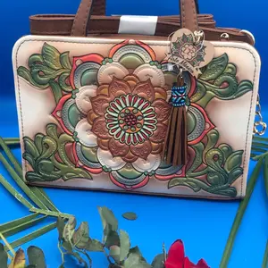 Anuschka Floral Embroidery Handbag with Tassel Detail and Adjustable Strap for Everyday Use