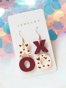 Love printed XO pendant earrings are suitable for daily wear, vacation dates, and other occasions, and are also a surprising and exquisite small gift