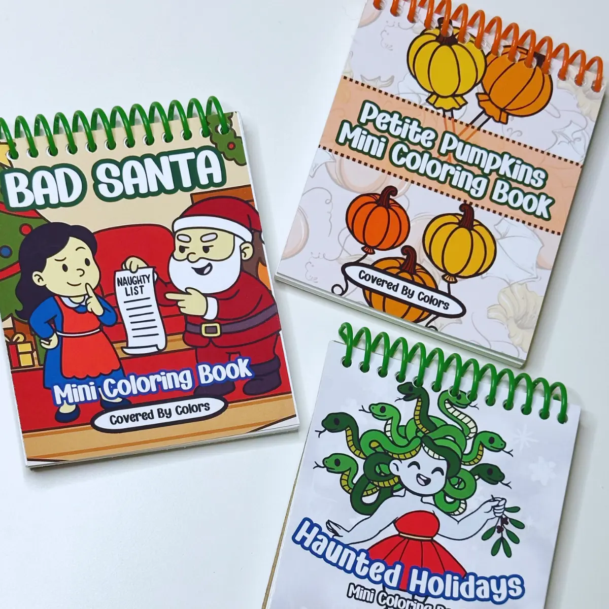 Holiday Coloring Books Bundle Premium Thick Cardstock Spiral Holiday Coloring Book, Mini Book and 3 Postcards Holiday Editions -  Christmas Gift Funny Coloring Book by Covered by Colors Ideal for All Ages