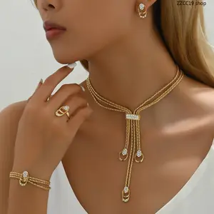 Women's 4-Piece Rhinestone Tassel Bow Jewelry Set - Gold Multi-Layer Chain Necklace, Earrings, Bracelet, Ring - Luxury Female Jewelry for Daily Wear, Party Occasions