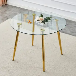 A glass tabletop with a diameter of 40 inches and a modern minimalist circular dining table with electroplated golden metal legs.Suitable for living rooms, and conference rooms