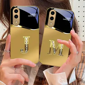 Diamond letter M Phone case Cover suitable for Samsung Galaxy S25 Edge/S21 FE/S22/S23/S23 FE/S23+/S23 Ultra/S24 FE/S24 Plus/S24 Ultra//S25 Ultra/S20/S21+/S21 Ultra/S22+/S22 Ultra/S21/S20+/S20Ultra/S25Plus/S20FE Golden glass protective case