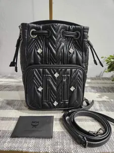 Pre-owned MCM Leather Crossbody Bags Bucket Bag with Rhinestones and detachable strap