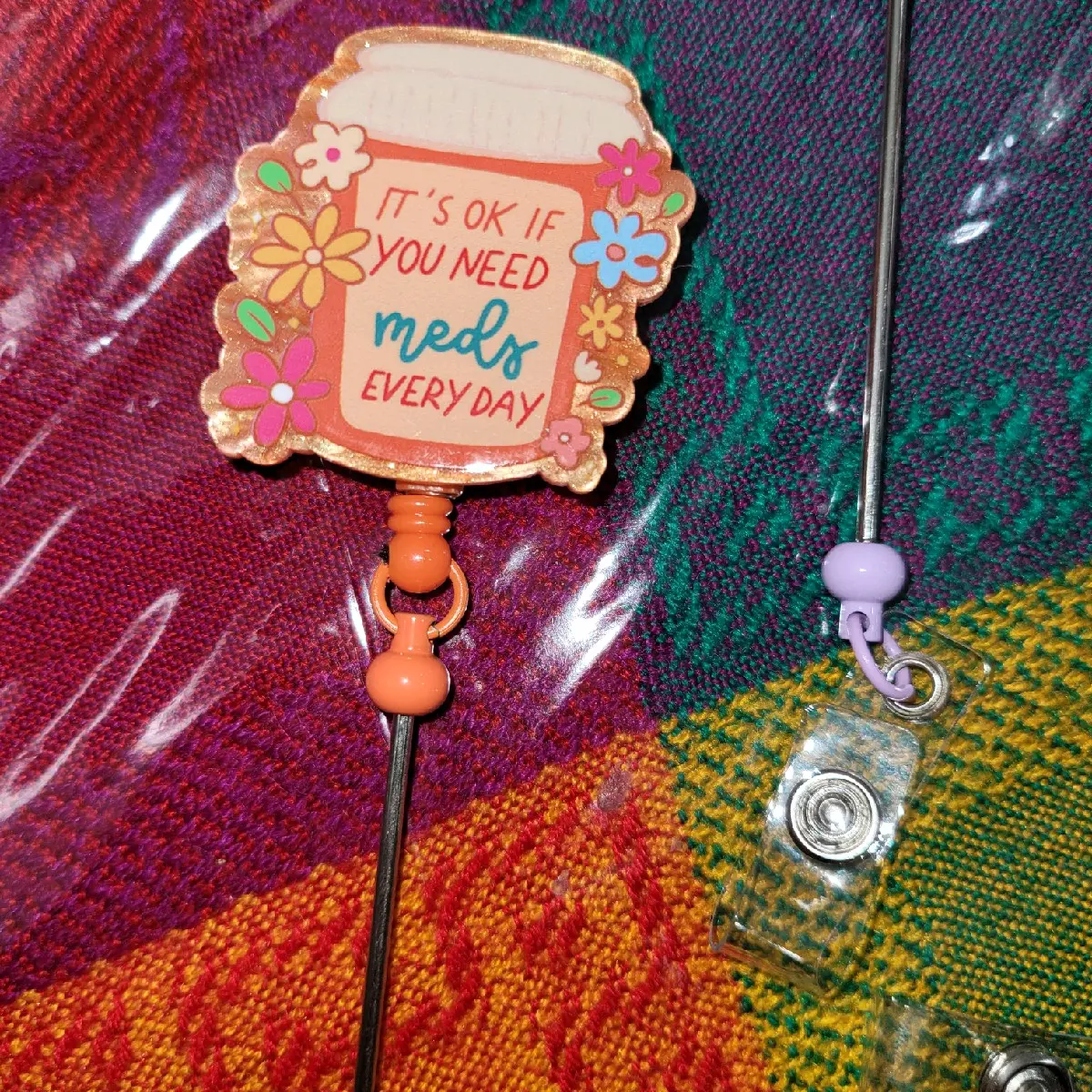 live badge real diy for all different people.  many colors available. they are made to order what ever way you like. made from stainless steel and outside acrylic. also has a pull string with a hook.