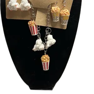 Movie night 3 piece set 2 pair of earrings and a charm bracelet realistic popcorn set . Dopamine, funky and cute .
