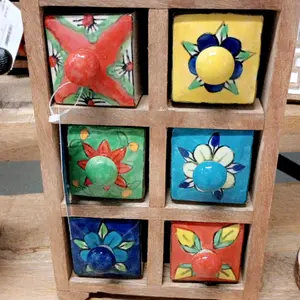 Porcelain and wood cubical drawers. Hand painted.
