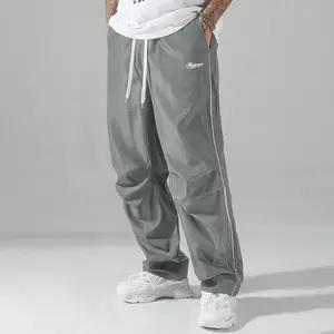 Loose casual street style men's pants, featuring a simple line decoration on the legs, exuding a trendy vibe. Highly recommended for comfort, ease of wear, and a slimming effect. daily wear pant