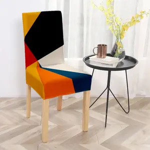 Geometric color blocked printed dining chair slipcover, designed with a combination of black, white, orange, yellow, and deep blue blocks, modern and minimalist style, suitable for home or restaurant chair decoration
